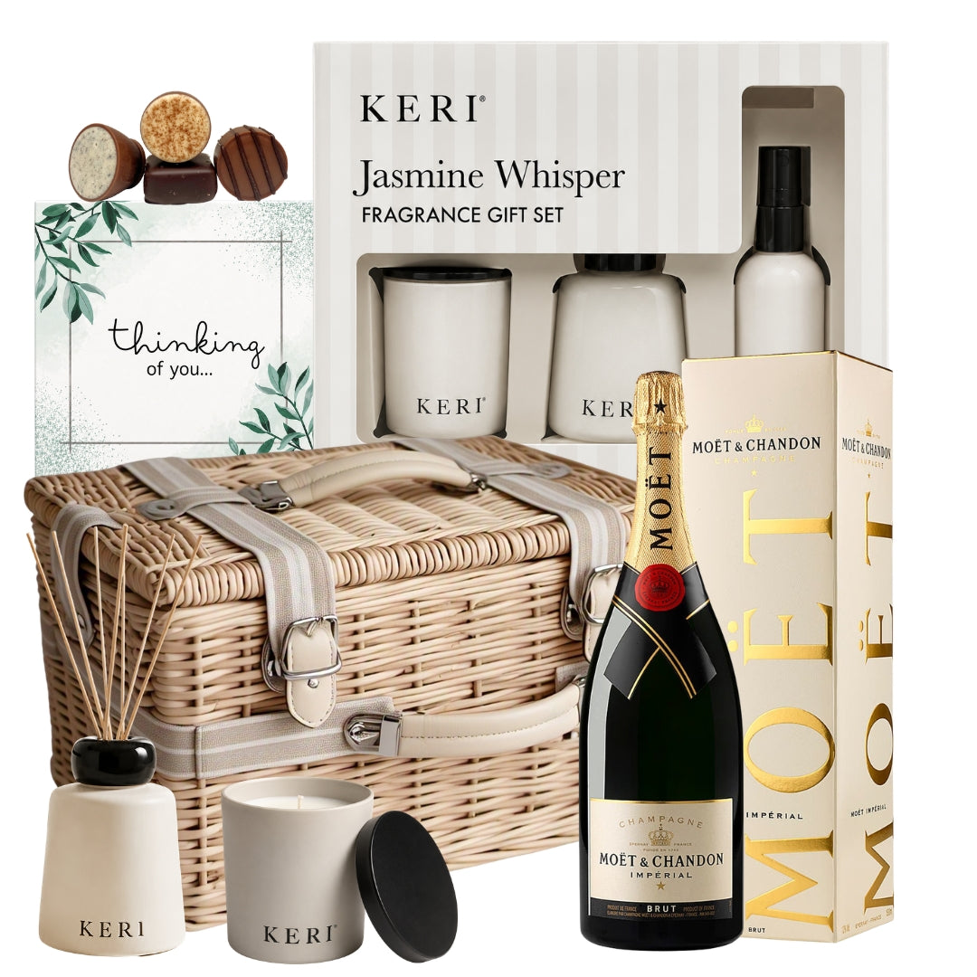Sympathy gift basket featuring Moët Brut Impérial Champagne, a luxury jasmine fragrance gift set, and a Thinking Of You chocolate box