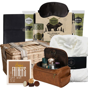 Luxury men’s gift basket featuring a bathrobe, hemp and aloe grooming products, eye mask, notebook, and toiletry bag
