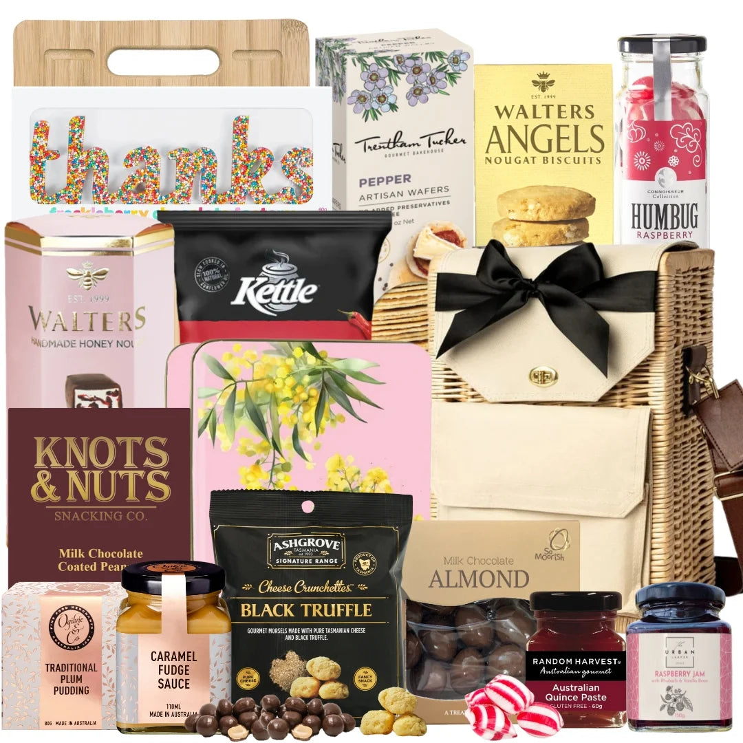 Thank you gourmet gift basket featuring chocolates, nougat, shortbread, wafers, quince paste, chips, almonds, and a Freckleberry “THANKS” freckle