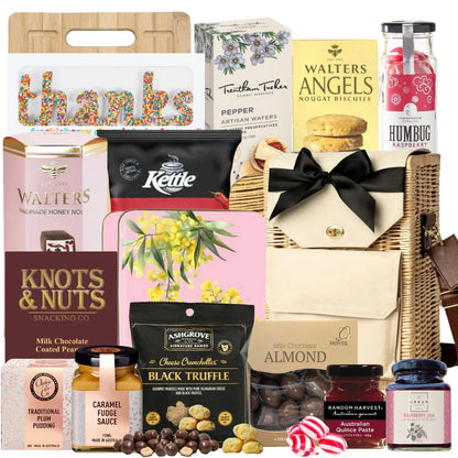 Thank you gourmet gift basket featuring chocolates, nougat, shortbread, wafers, quince paste, chips, almonds, and a Freckleberry “THANKS” freckle