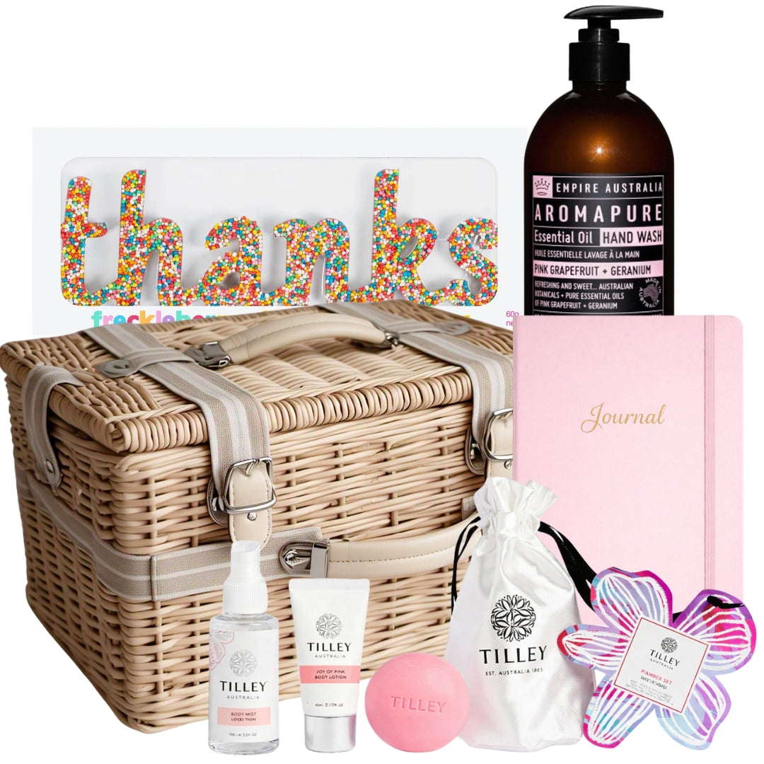 Teacher thank you pamper hamper featuring a body care set, pink notebook, hand wash, and a Freckleberry “Thanks” chocolate treat